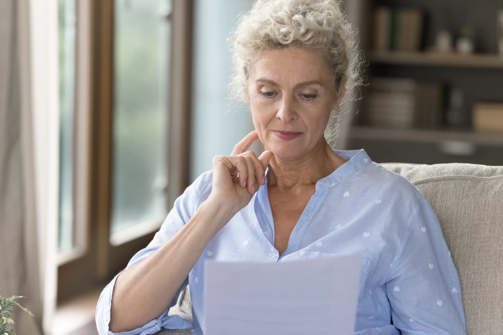 canadian-homeowner-reviewing-mortgage-documents-and-foreclosure-notice